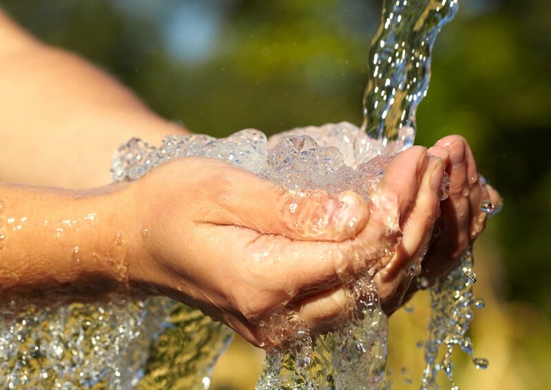 woman-s-hands-with-water-splash
